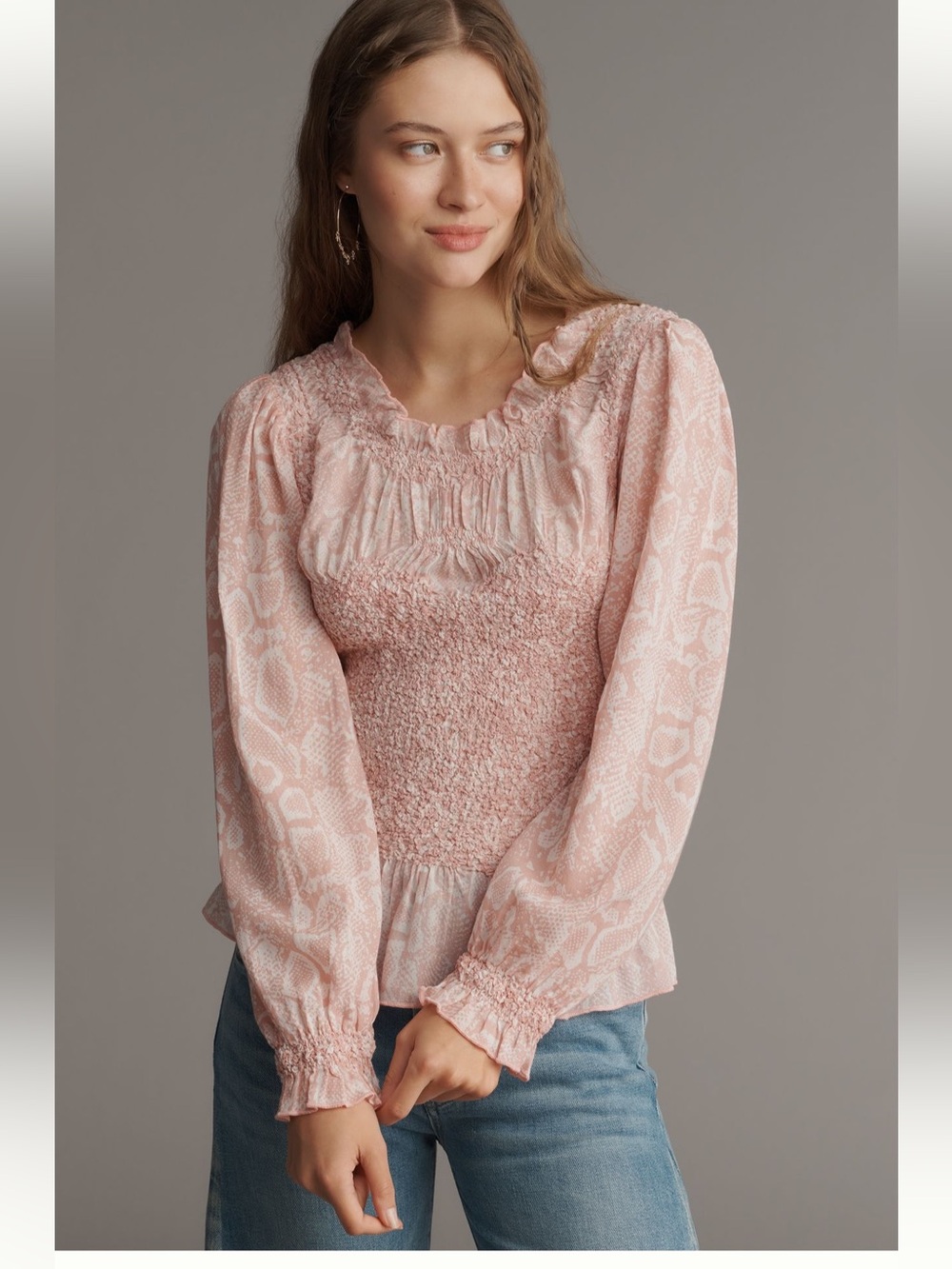 Anthropologie balloon-sleeve blouse features a delicate smocked bodice
